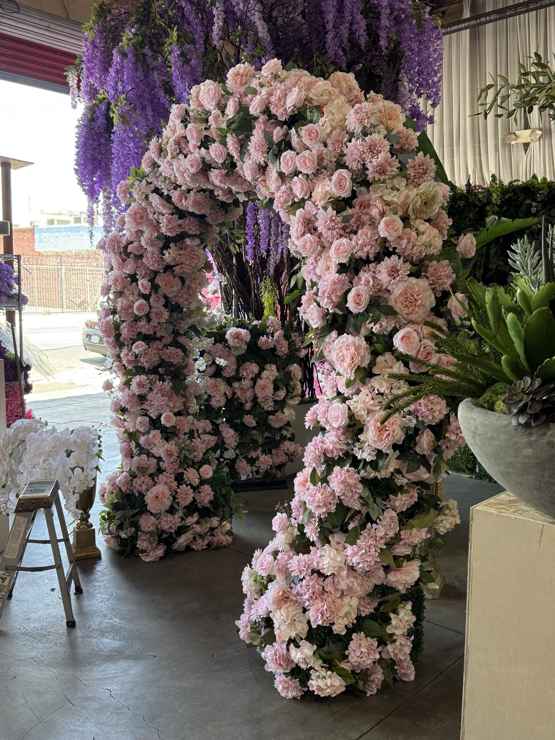 AxEr Events pink floral arch with purple wisteria