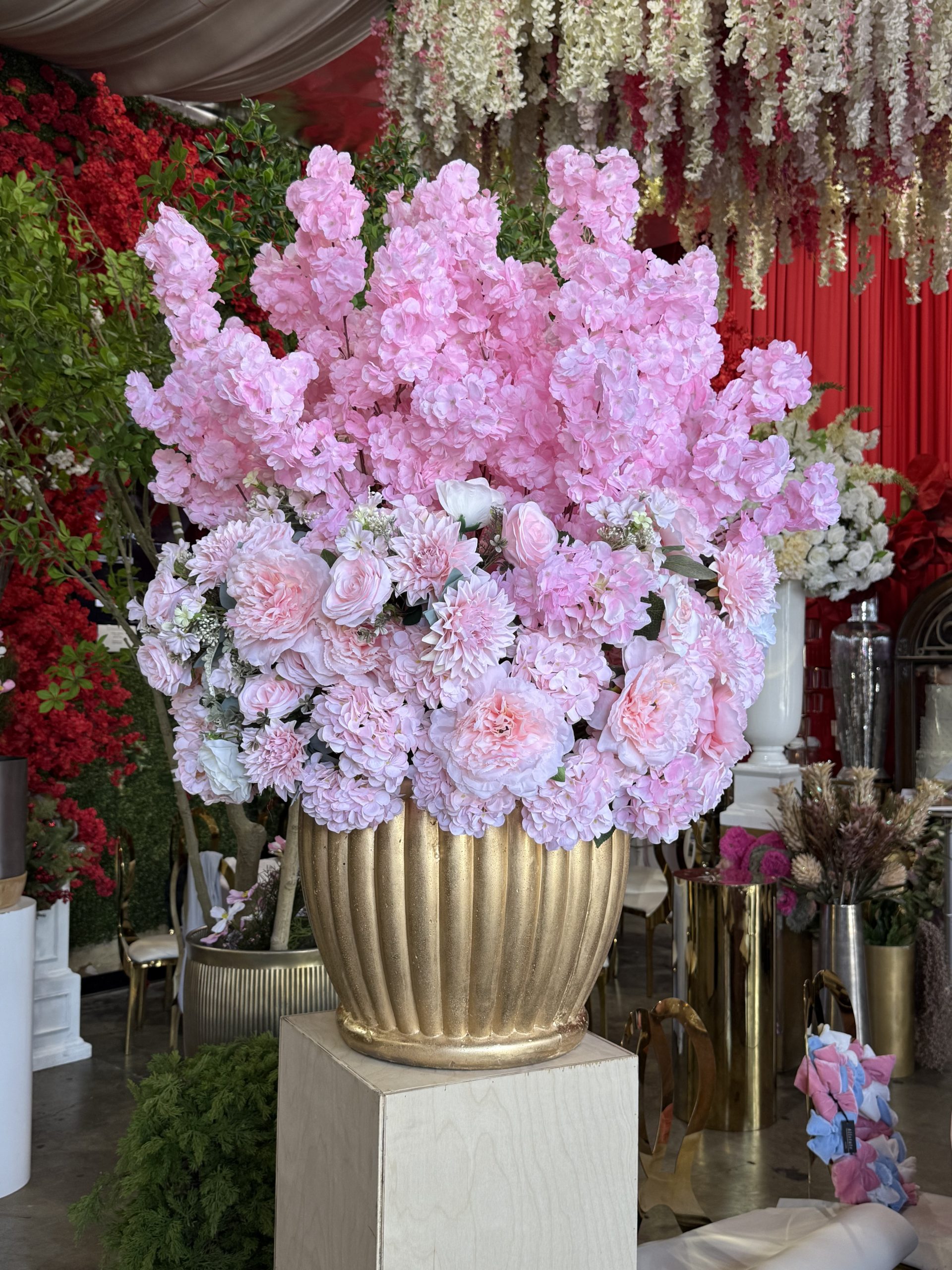 AxEr Events pink floral arrangement in gold urn Los Angeles